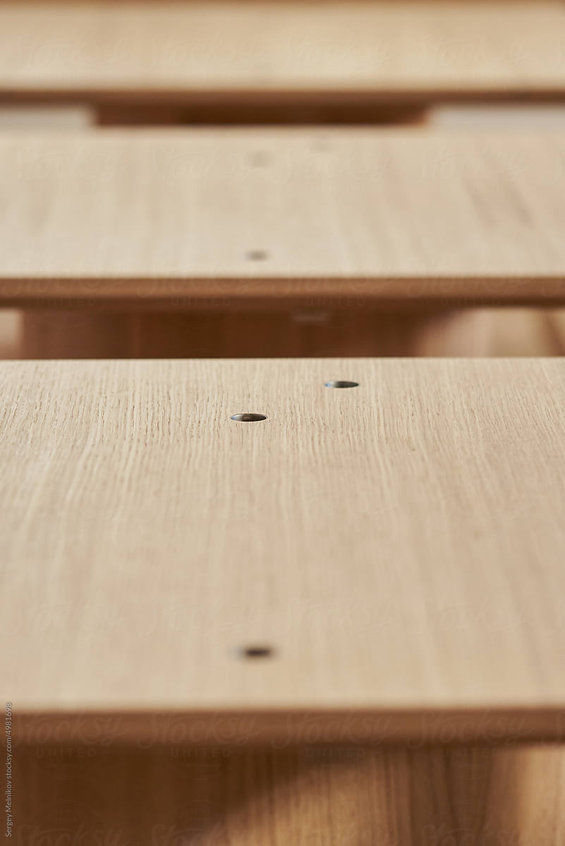 Perspective of wooden tables in the modern cafe