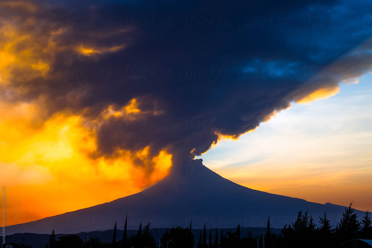 Sunset with Popocatepetl volcano fumaroles