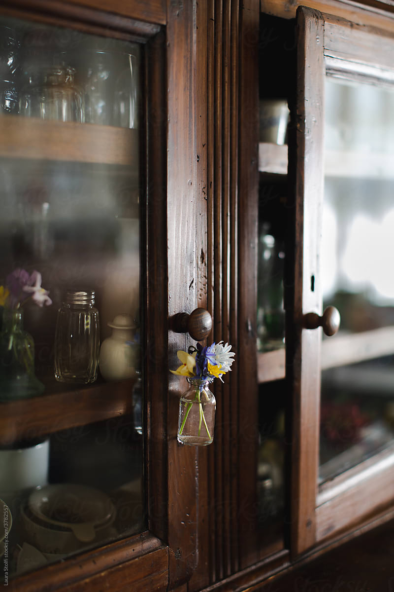 Hanging flower decoration in glass bottle