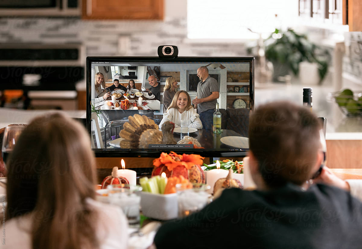 Thanksgiving: Family Sharing Holiday Meal With Relatives On Vide