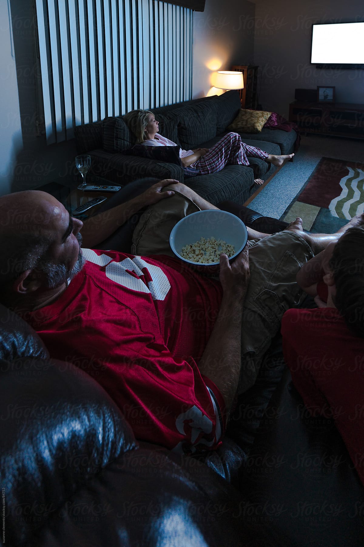 Family Enjoys Time Together Watching TV