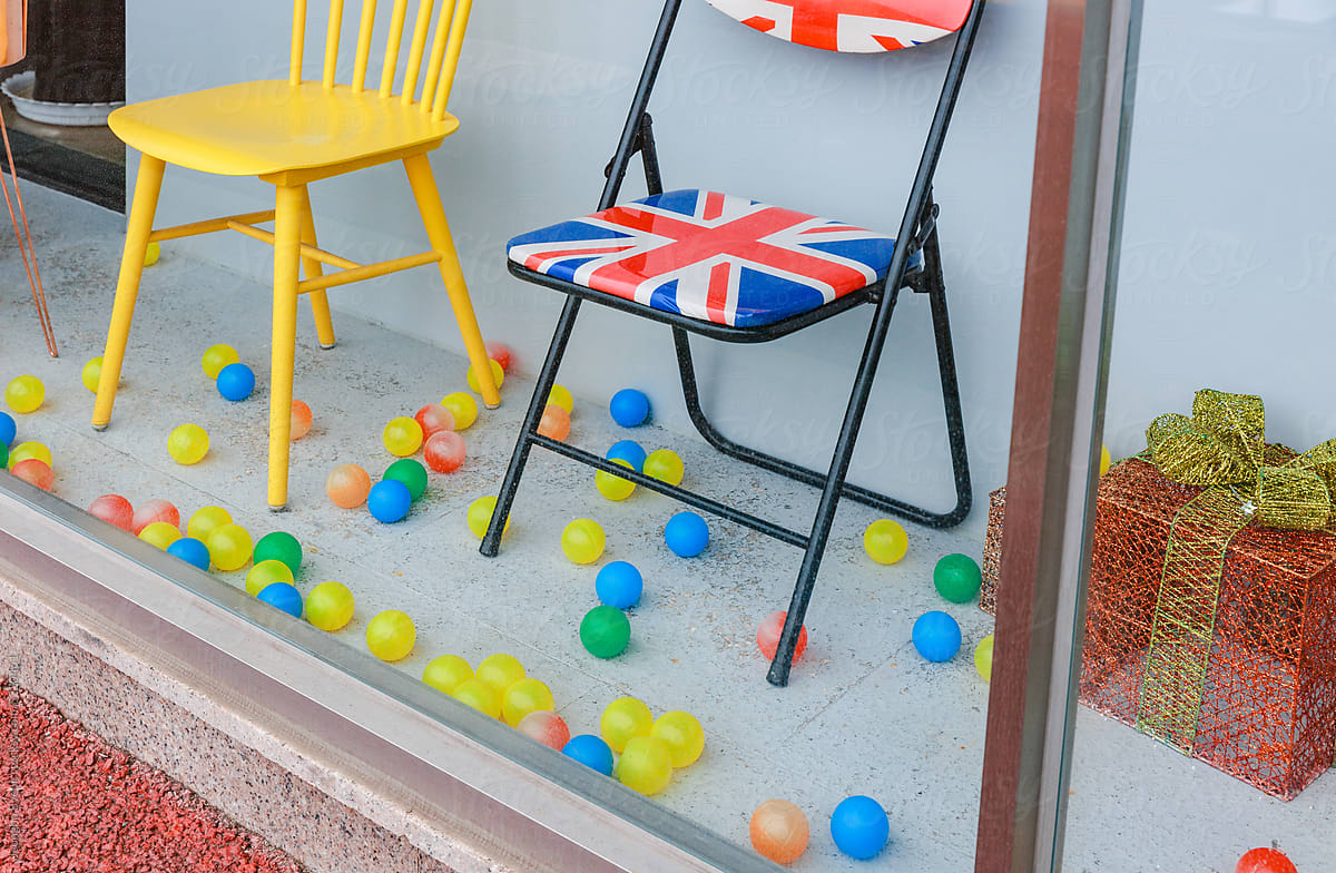 colorful chairs and colorful balls in the show window.
