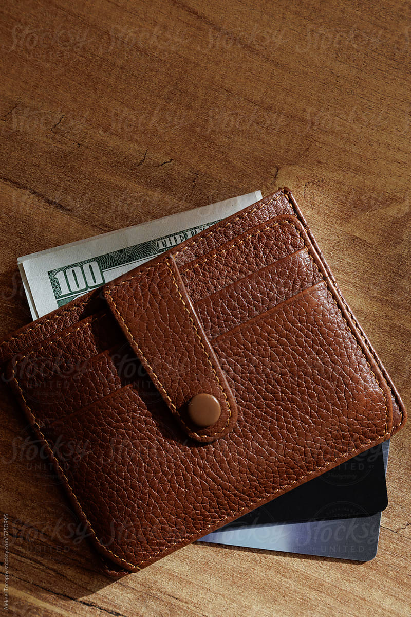 Wallet with dollars and bank cards