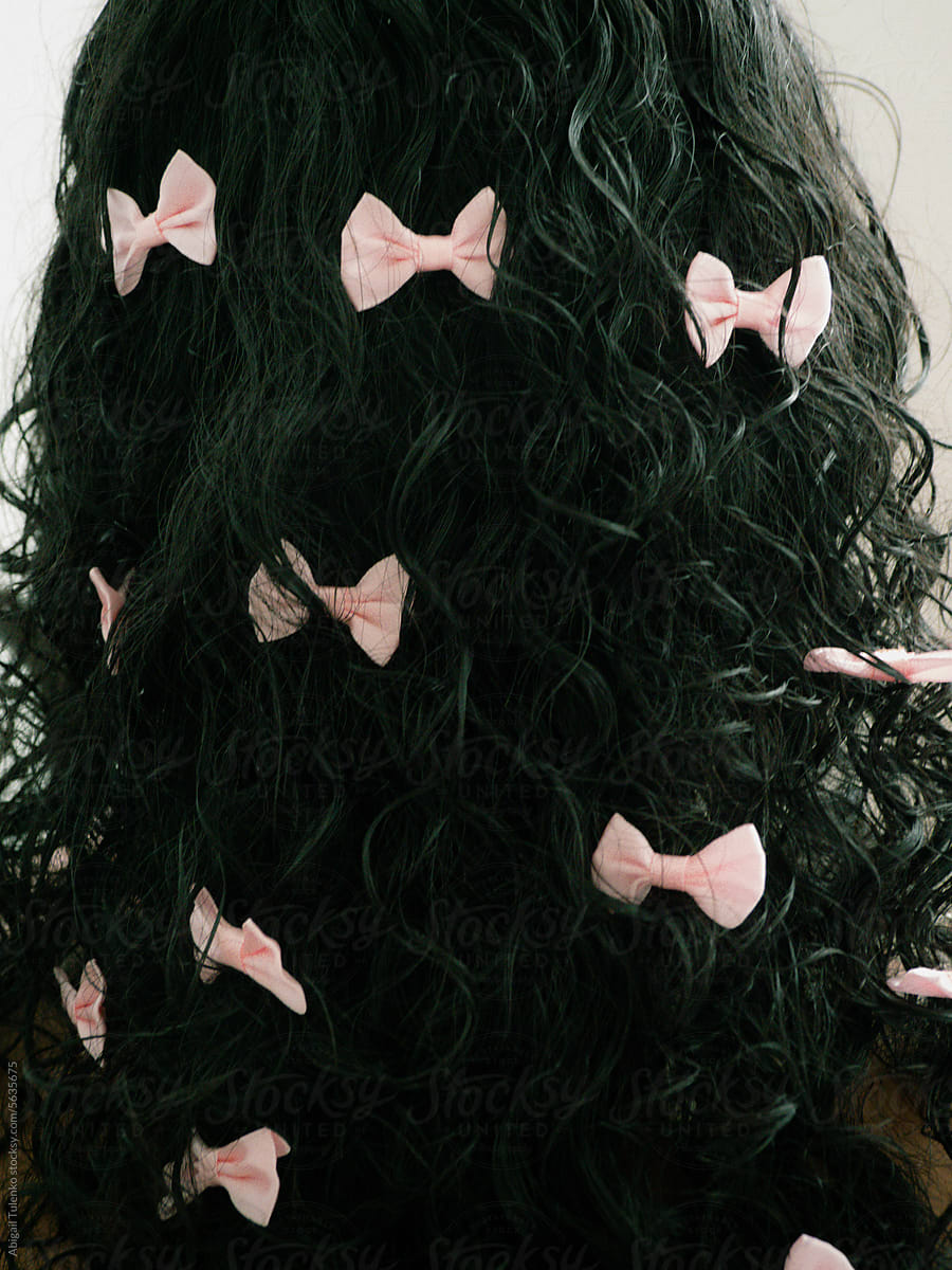 Many Pink Bows in Curly Hair