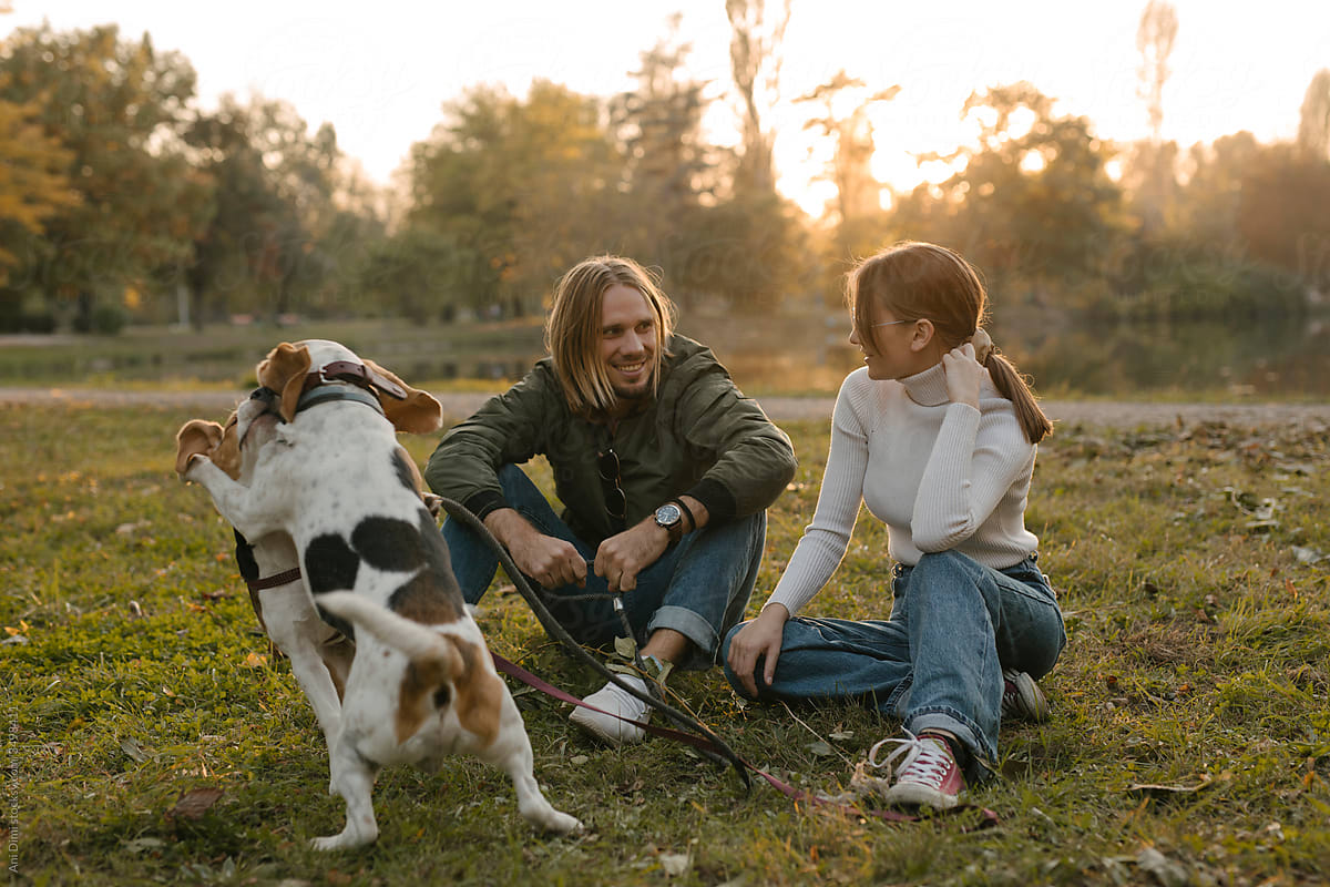 Young couple with their Beagle Dogs