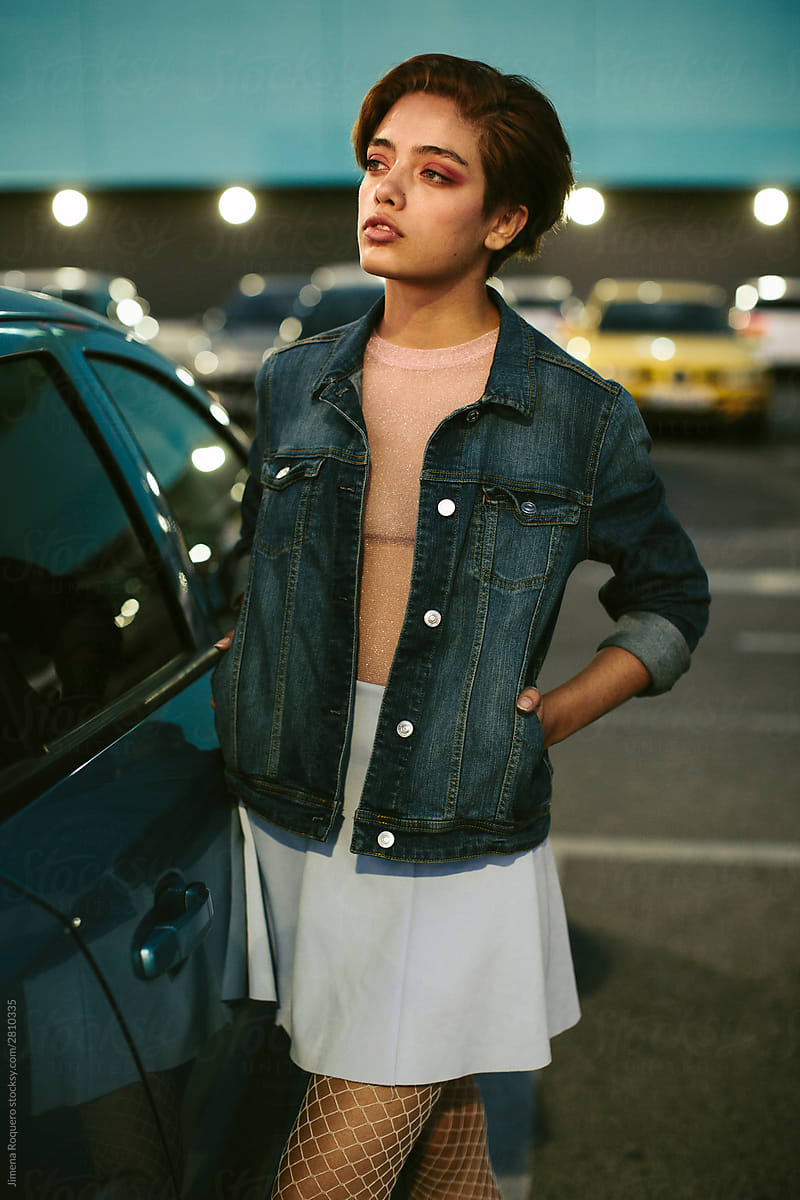Attractive woman standing in a parking lot