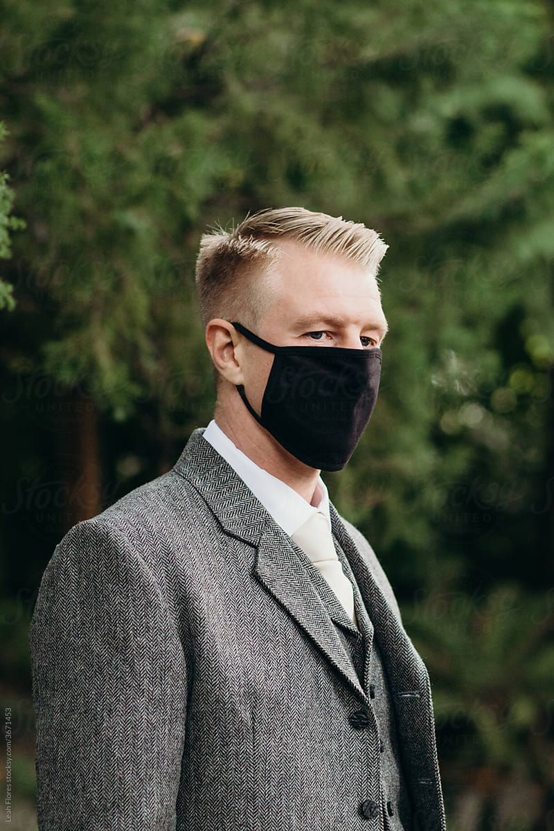 Portrait of Handsome Man in Suit Wearing Face Mask