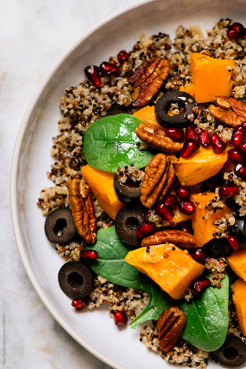 Easy winter salad with sweet potatoes, quinoa, spinach and pomegranate