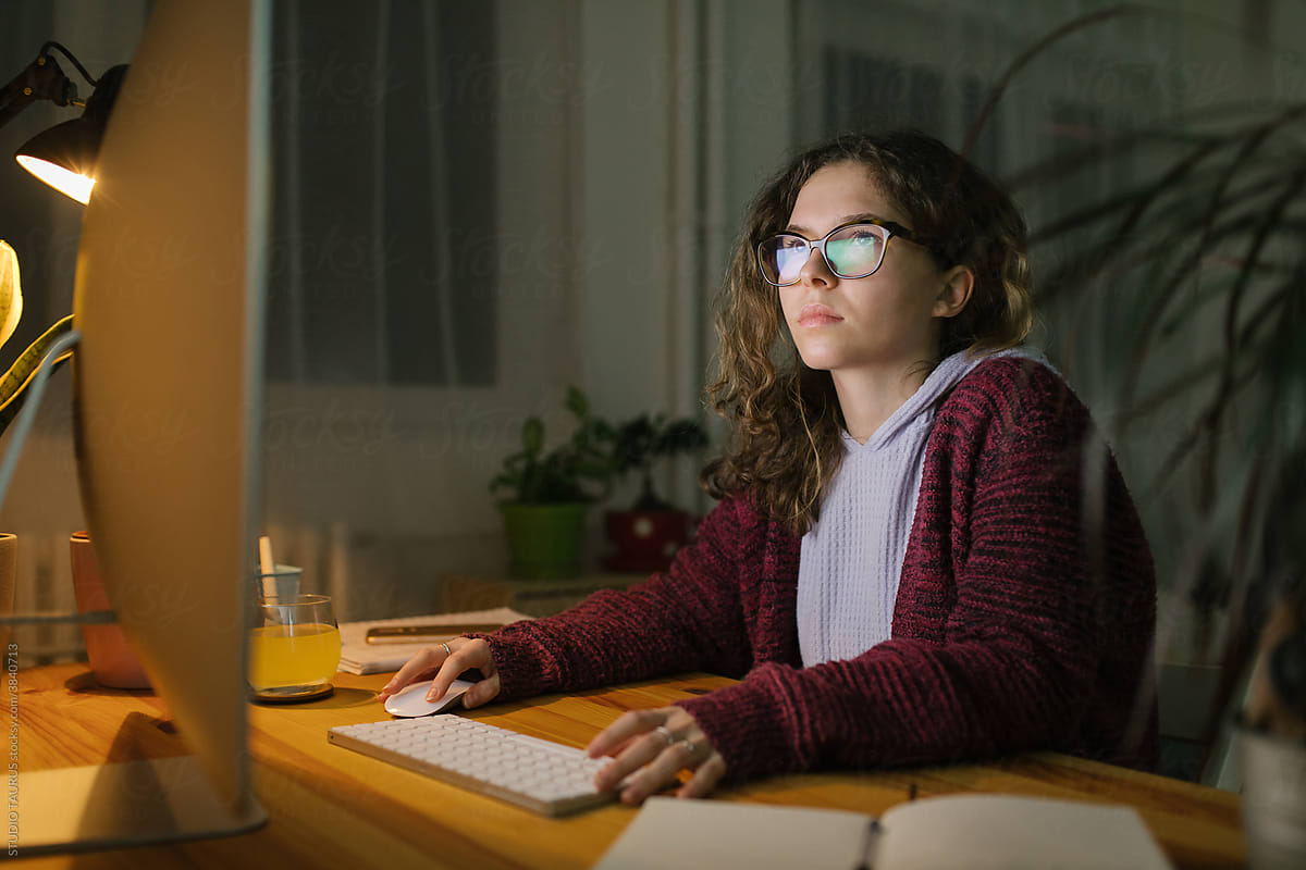 Young Girl Browsing Internet On Computer