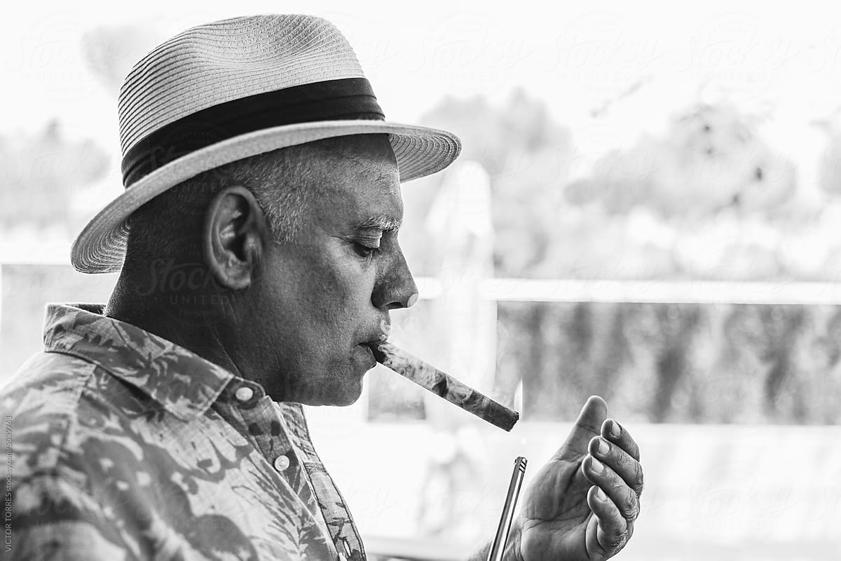 Senior cuban man smoking cigar