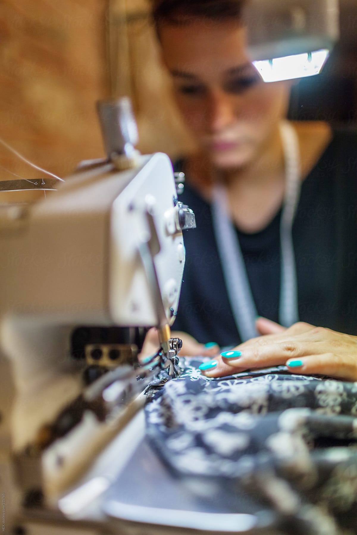 Young Tailor \'s Assistant Working an Handmade Dress With Sewing Machine