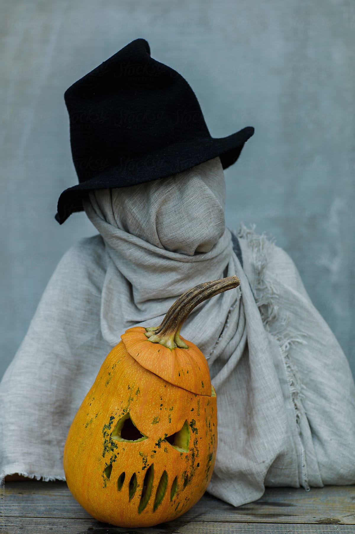 Mystic person with Halloween pumpkin