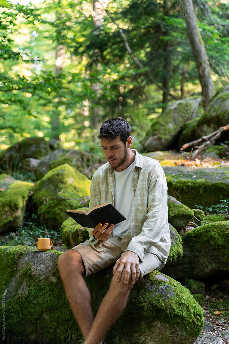 Man read book in nature