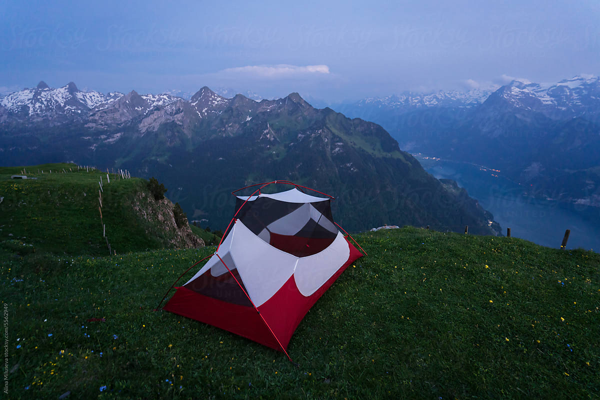 Camping Tent Against Mountain Range At Blue Hour
