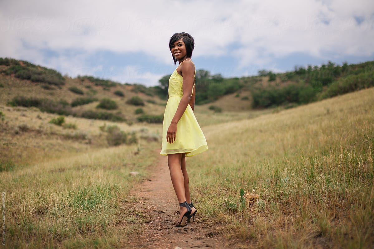 Black girl outside in yellow dress
