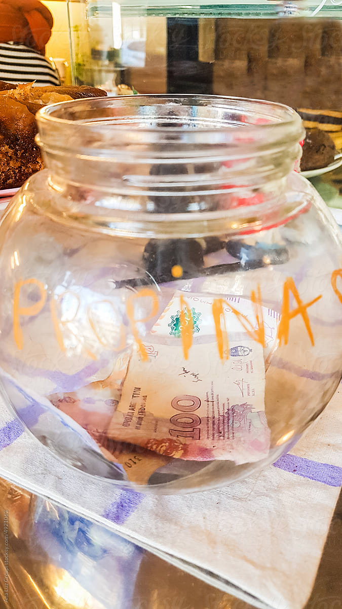 Tip jar with money inside