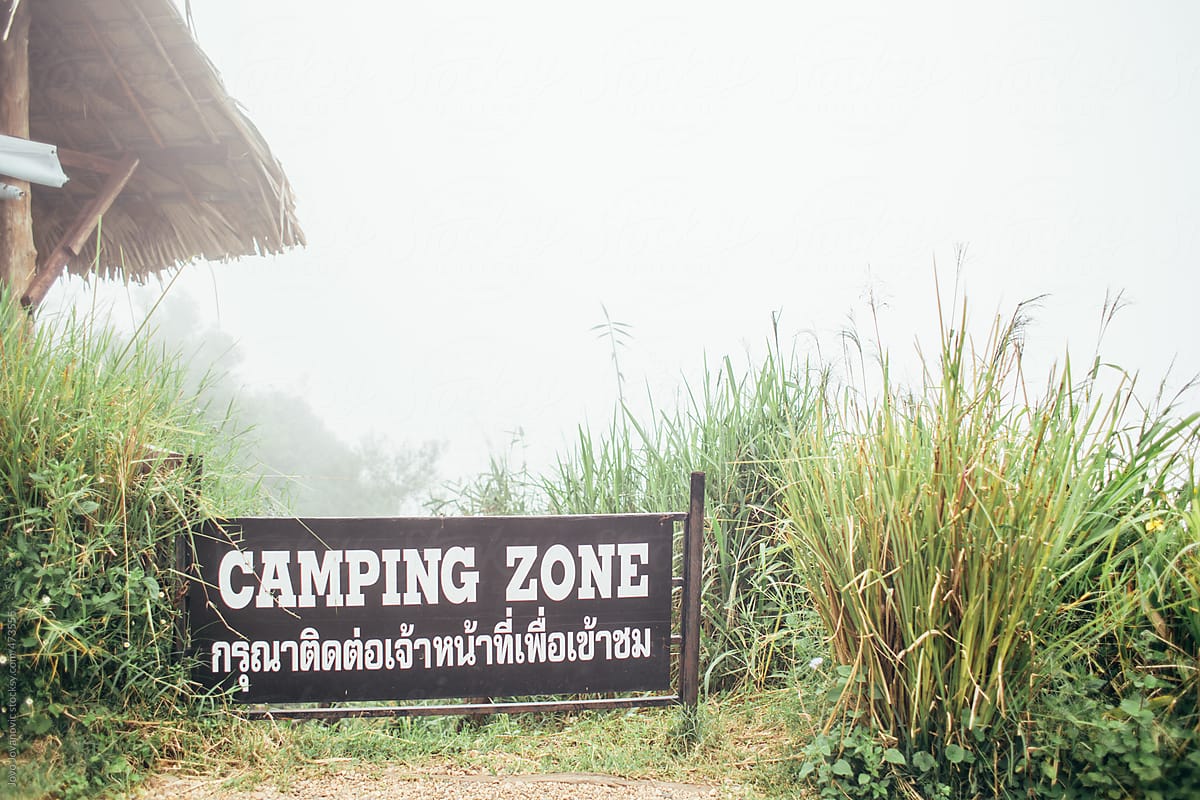 Sign for camping zone with fog in the back ground