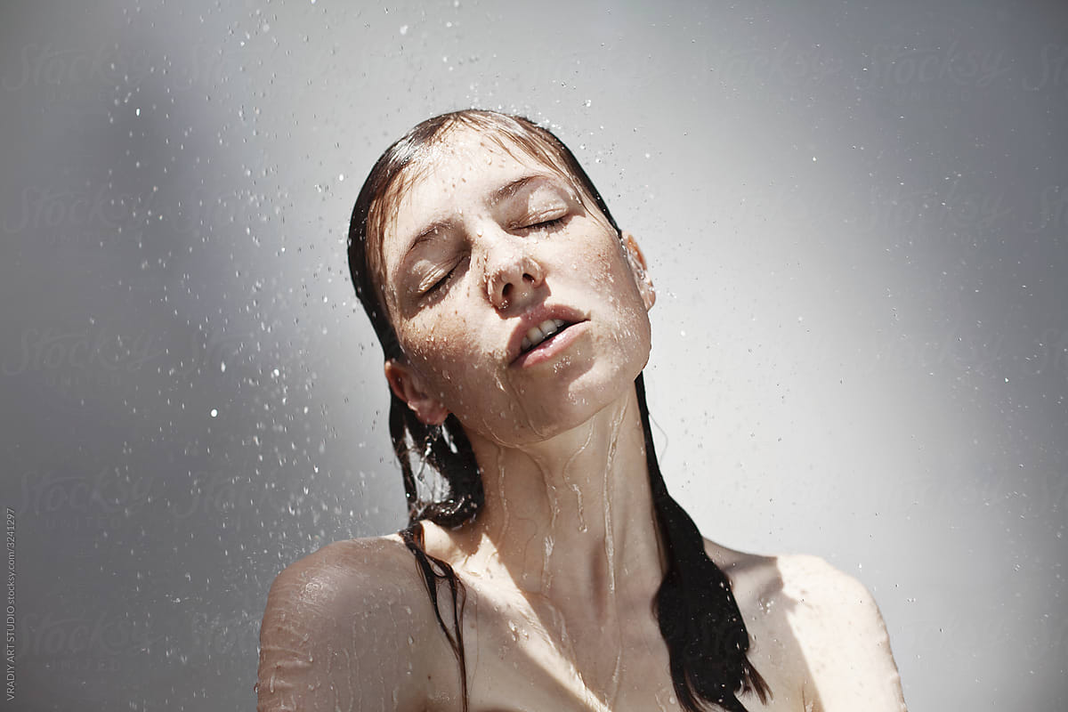 Young sensual woman in shower, Rain