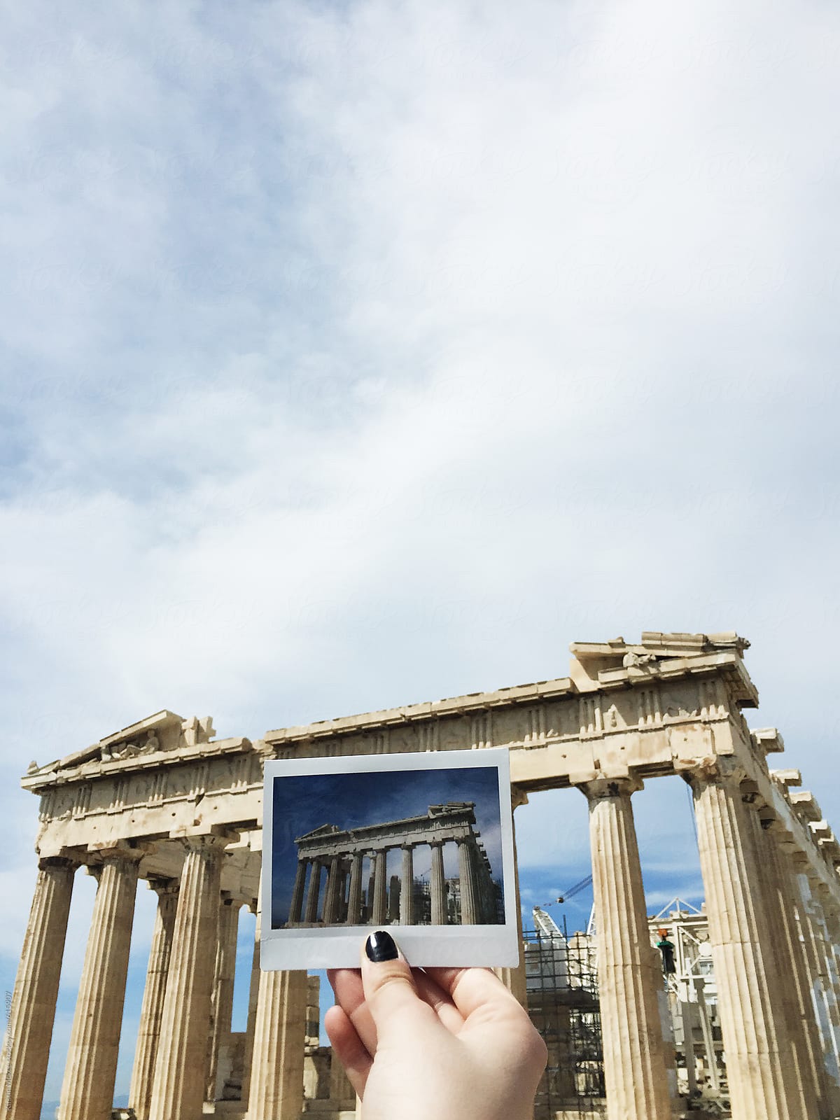 Holding up an instant image in front of the Parthenon