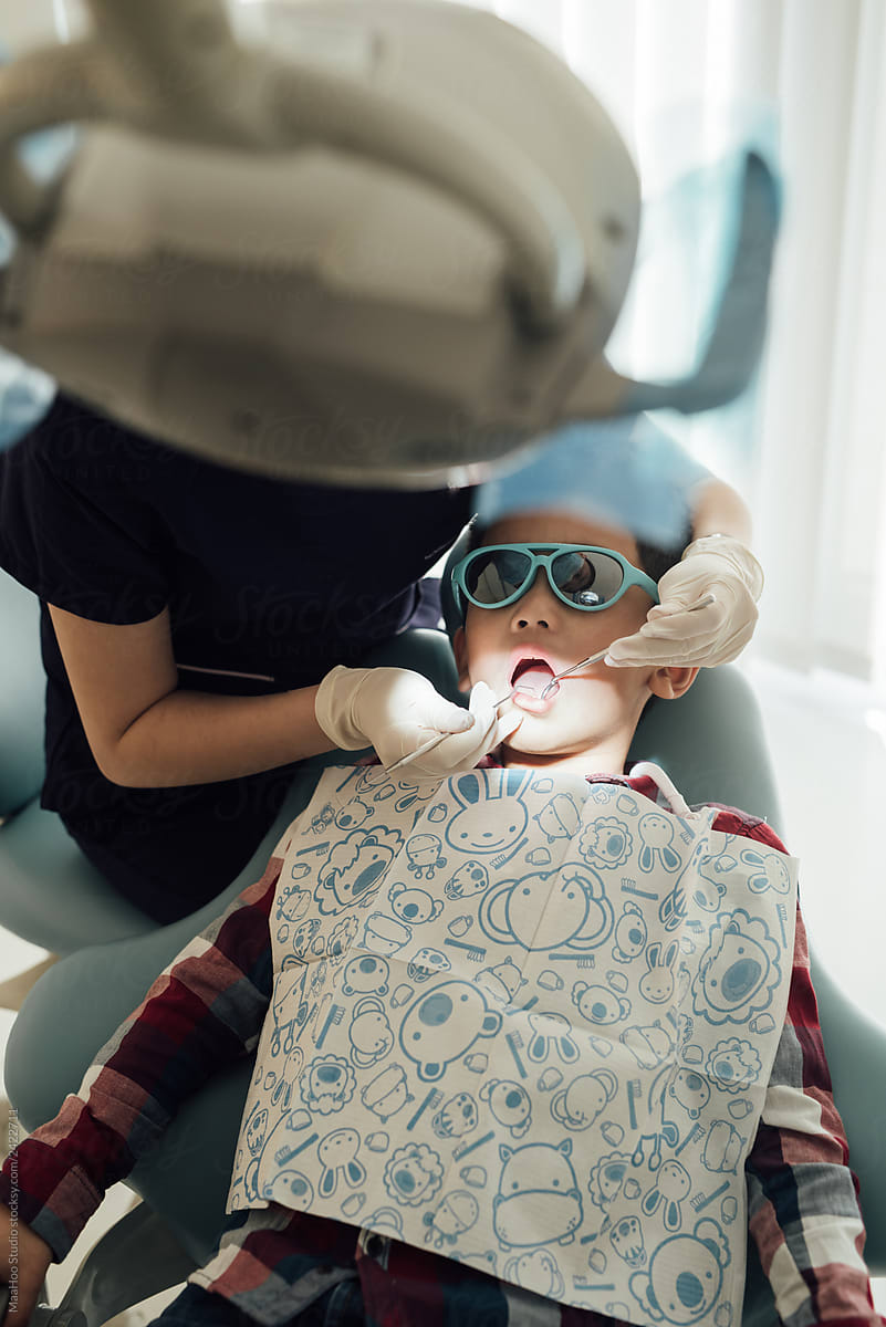 Female dentist examining teeth
