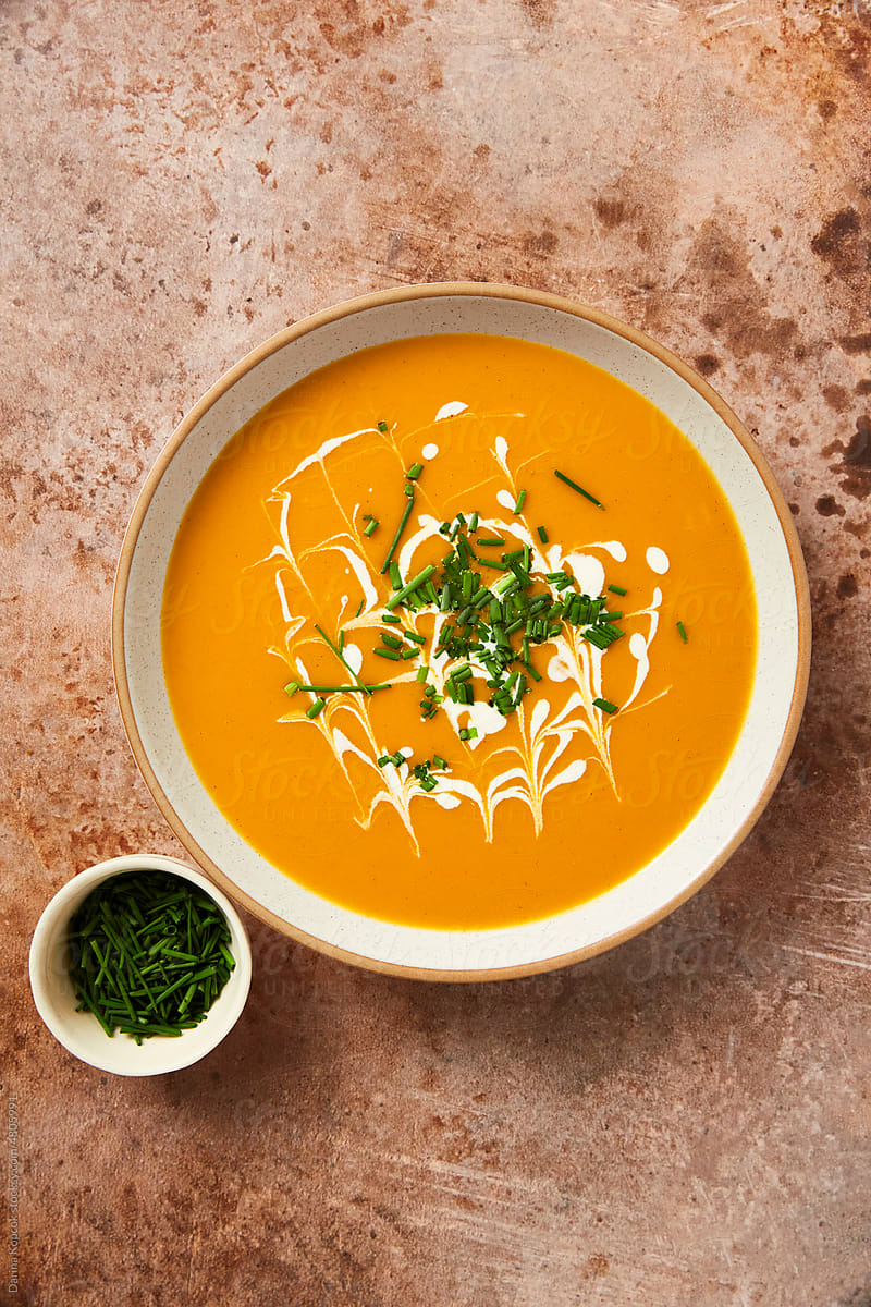 Single Ceramic Bowl of Butternut Squash Soup Served with Chives
