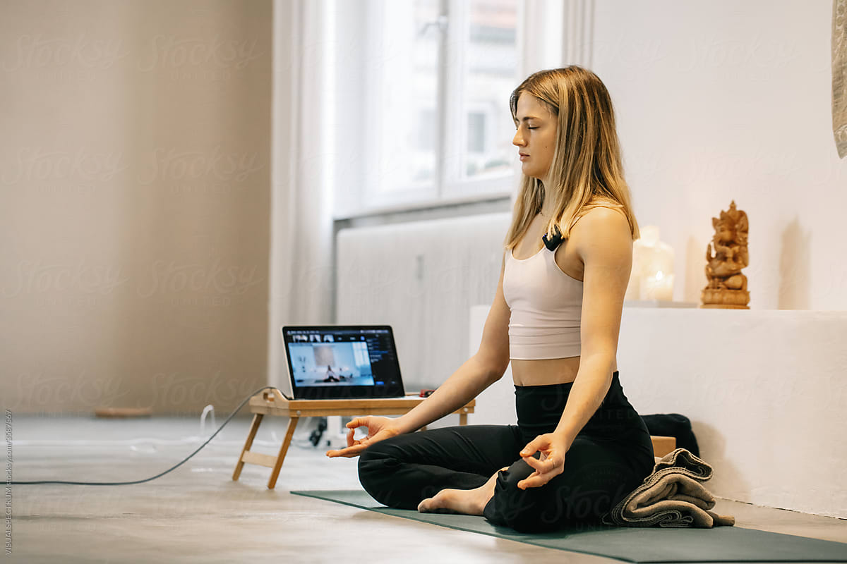 Female Yoga Instructor Teaching Online Mindfulness Meditation Class