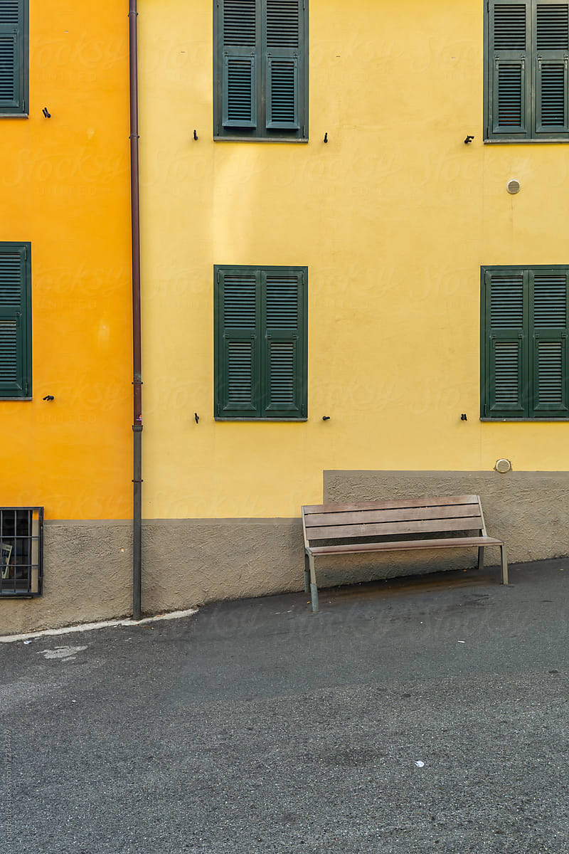 A yellow and orange building on a slope in Manarola, Italy