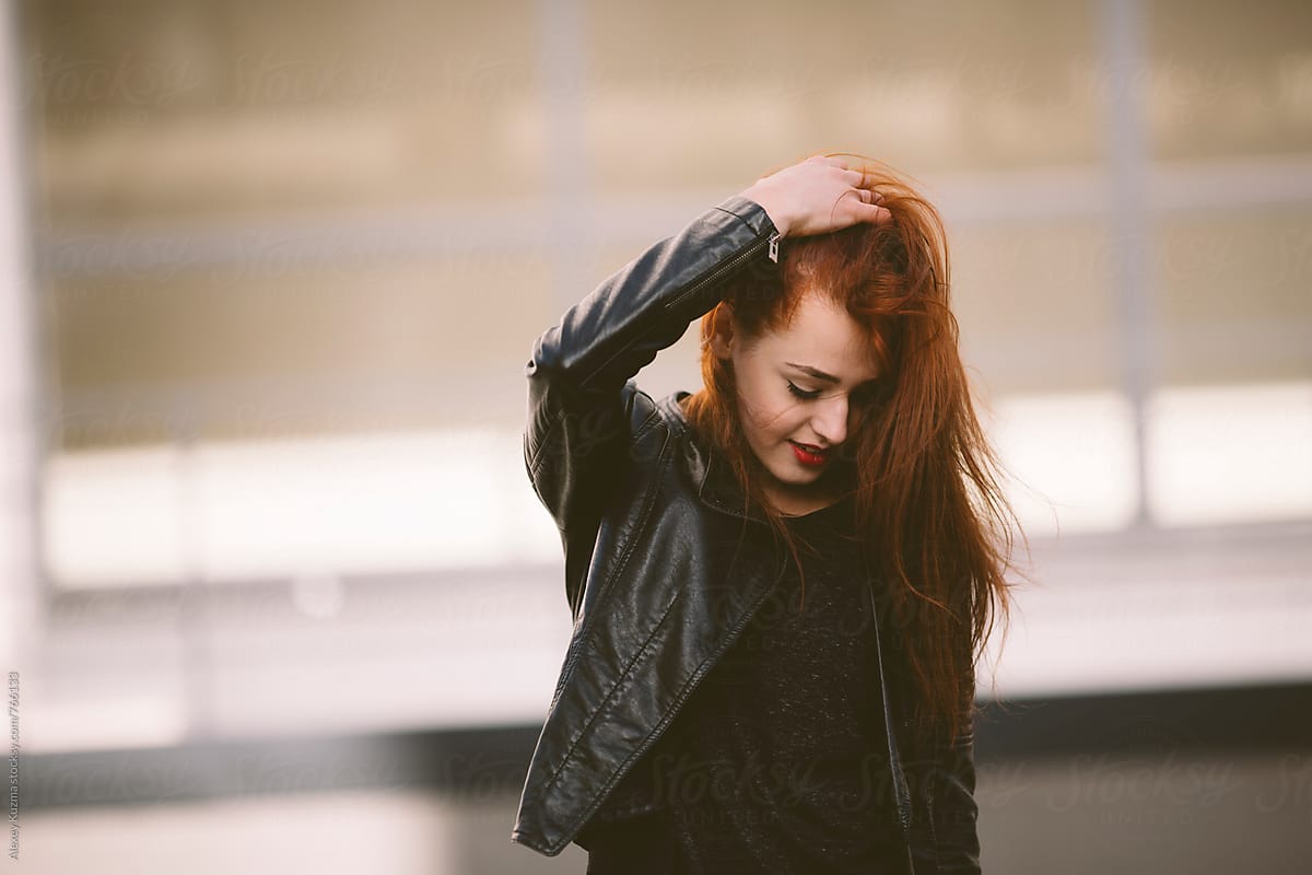 Young Woman With Red Hair On The Street By Stocksy Contributor Alexey Kuzma Stocksy