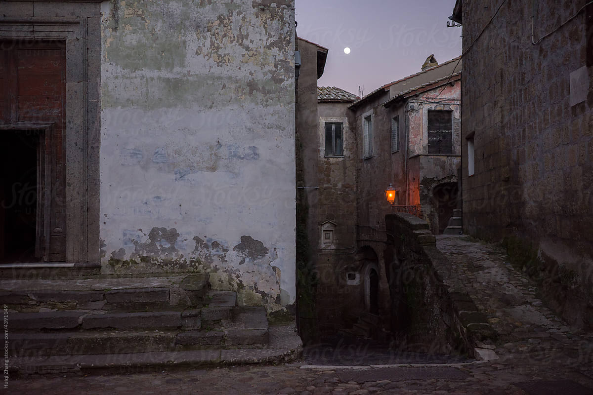 Moonrise in the old Italian city in winter