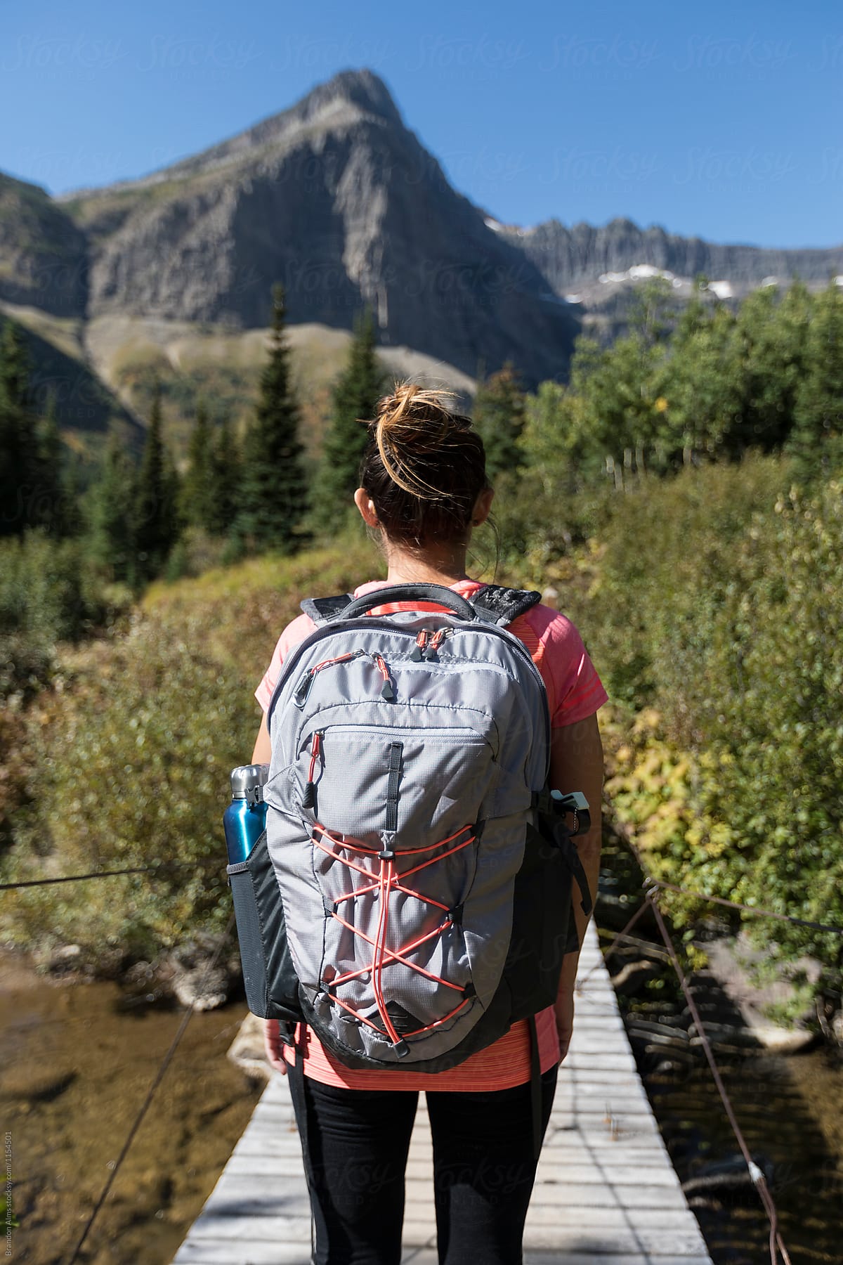 Woman Backpacking Through Glacier National Park