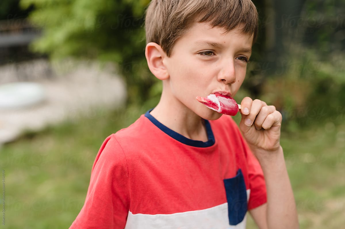 Child enjoying eating an ice lolly
