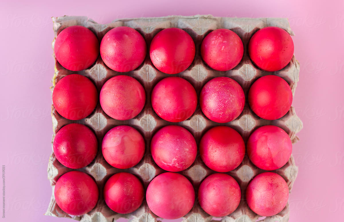Pink Easter eggs on pink background in the package