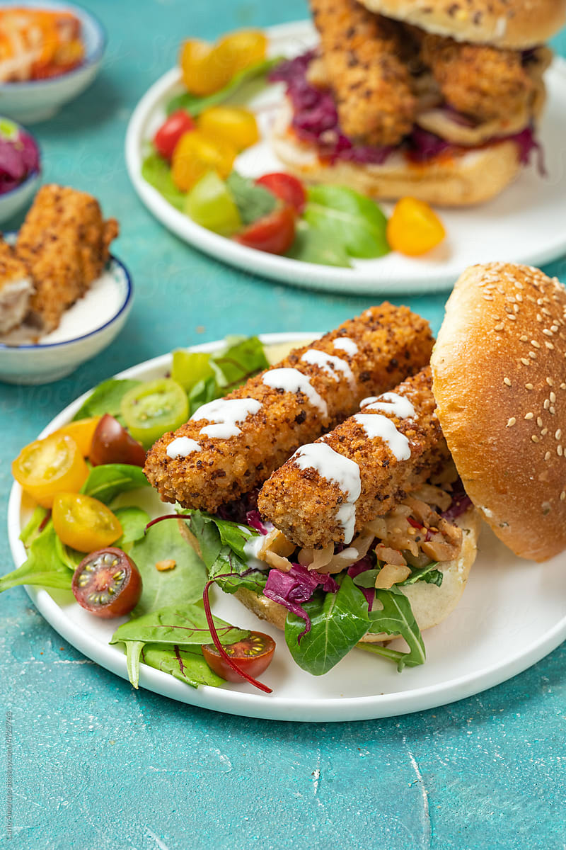 FInger Fish Sandwich with salad in a plate
