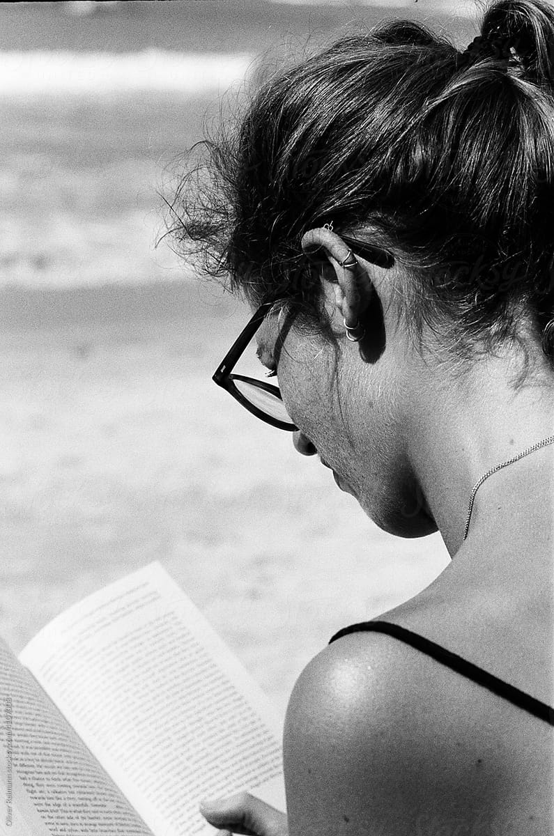 Woman Reading on Beach