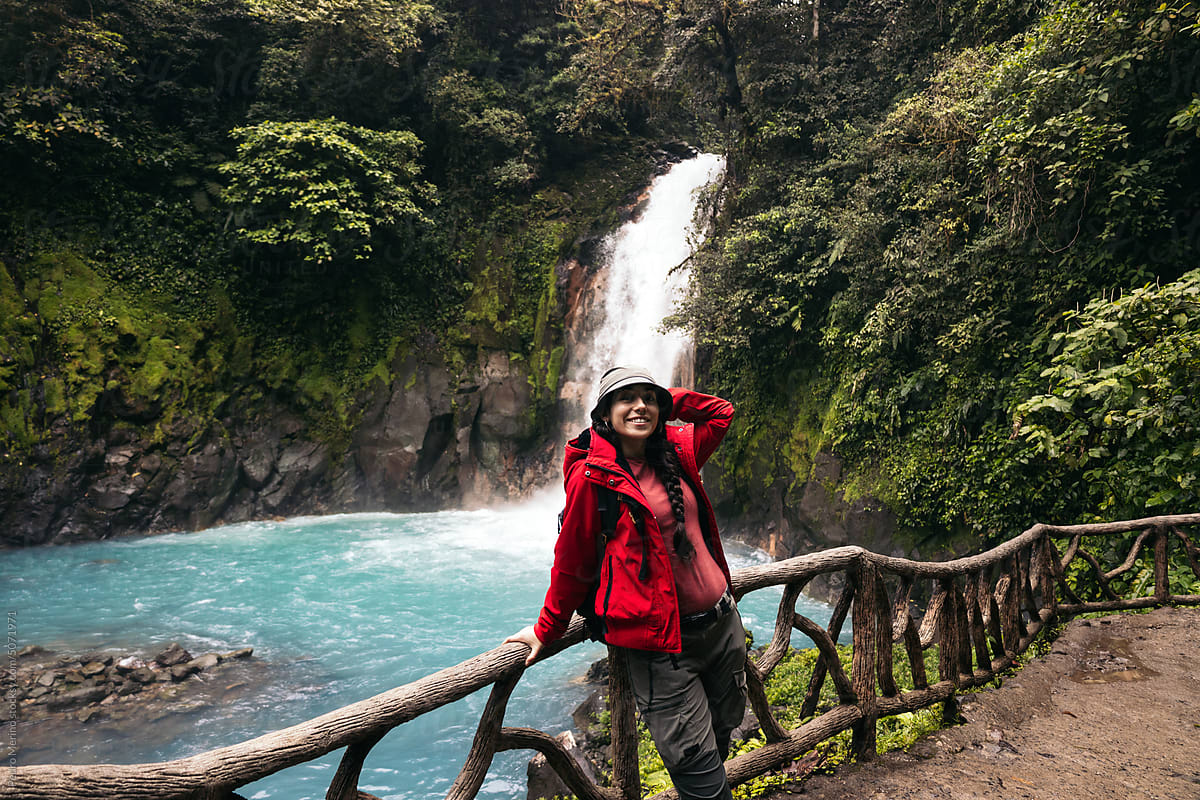 Woman visiting the Rio Celeste waterfall in Costa Rica