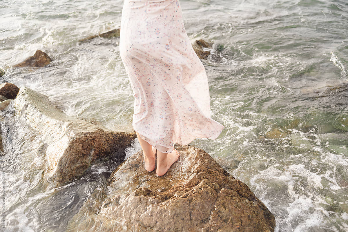 Dress and Bare Feet on Sea Rocks