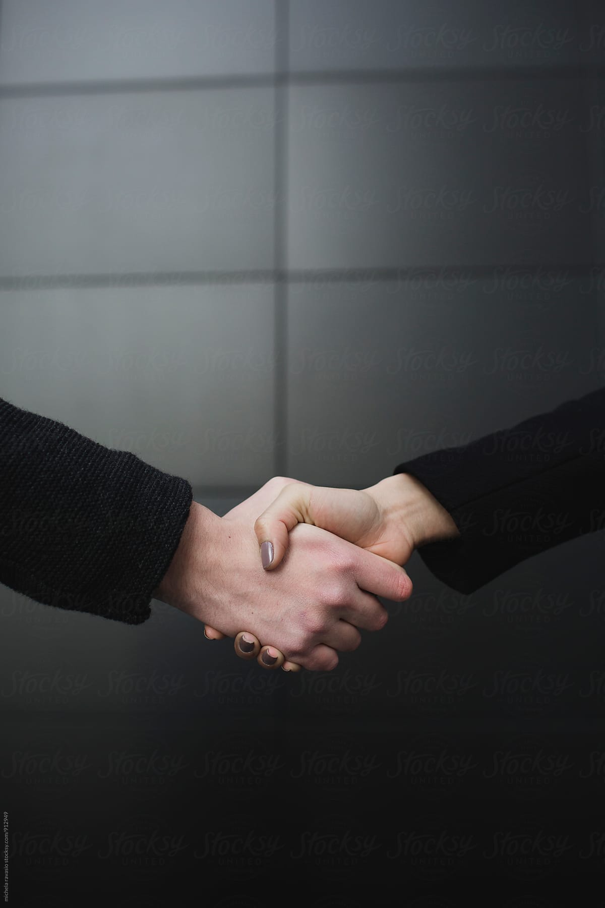 Handshake between man and woman