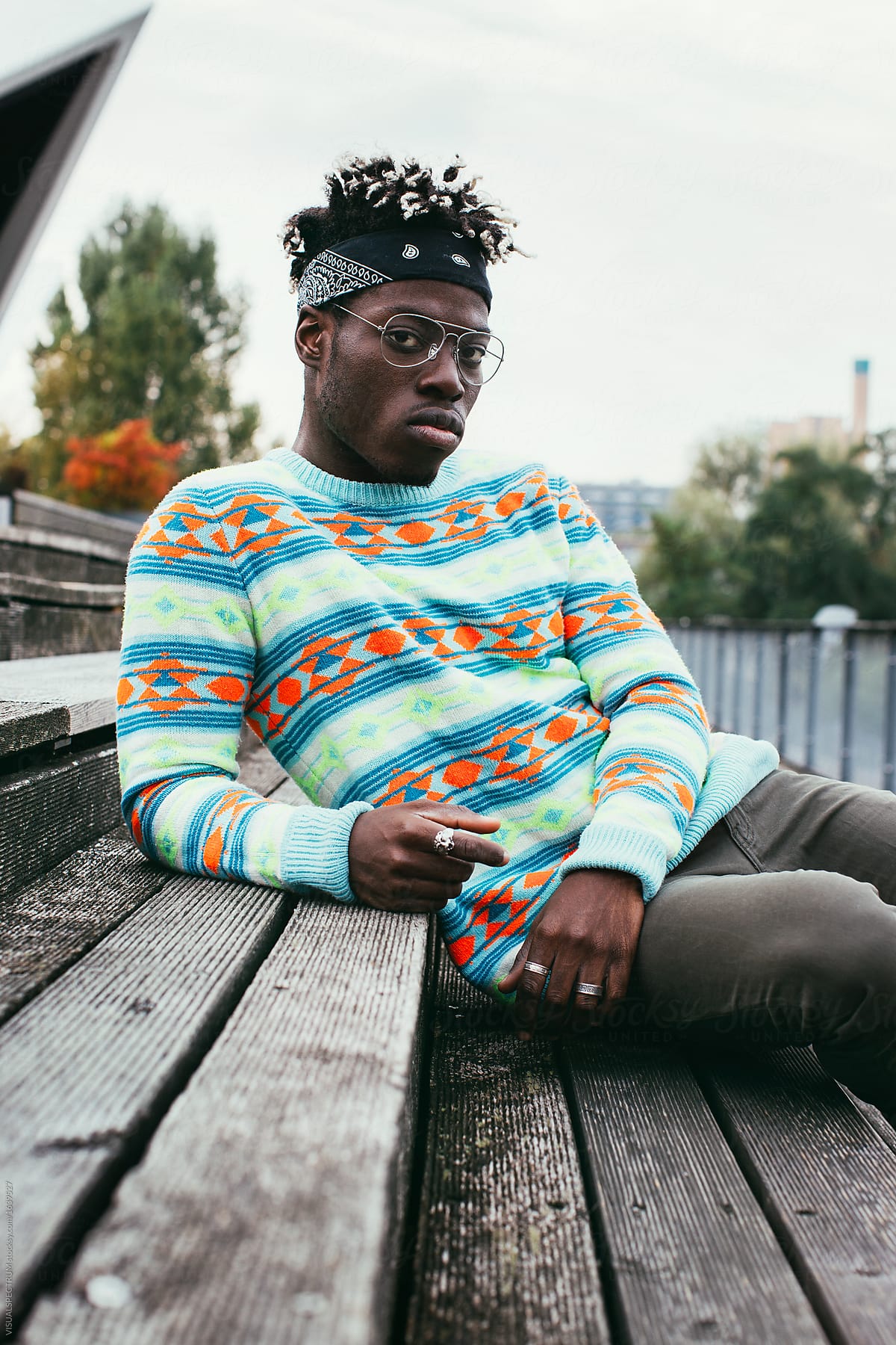 Outdoor Autumn Portrait of Young Black Man Wearing Colorful Jump