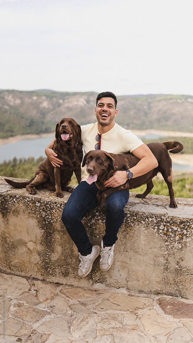 smiling man with his dogs