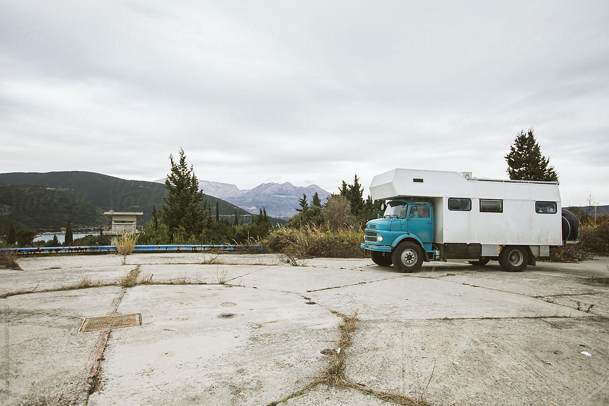 blue old camping truck on a helicopter landing place on a former military area