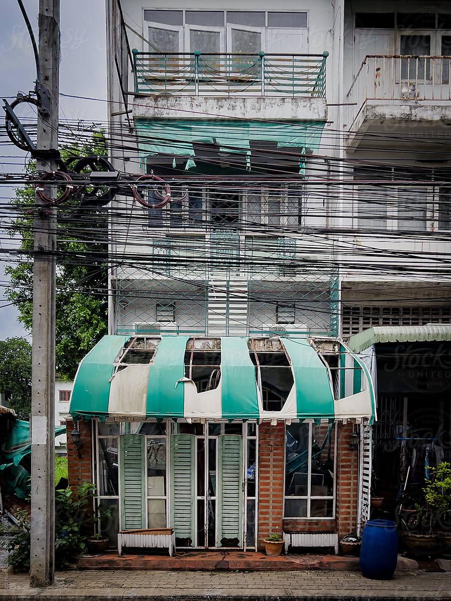 An abandoned home and storefront in a residential area of Bangkok