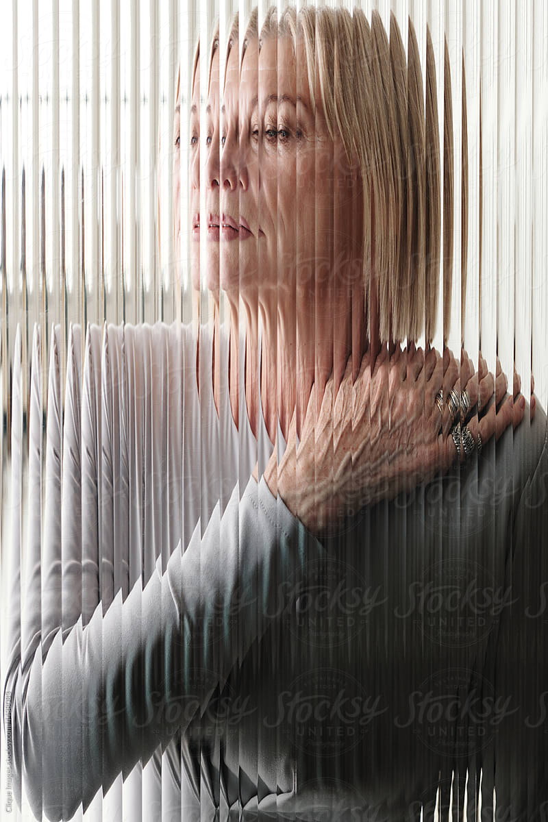 Senior Woman through Glass Wall
