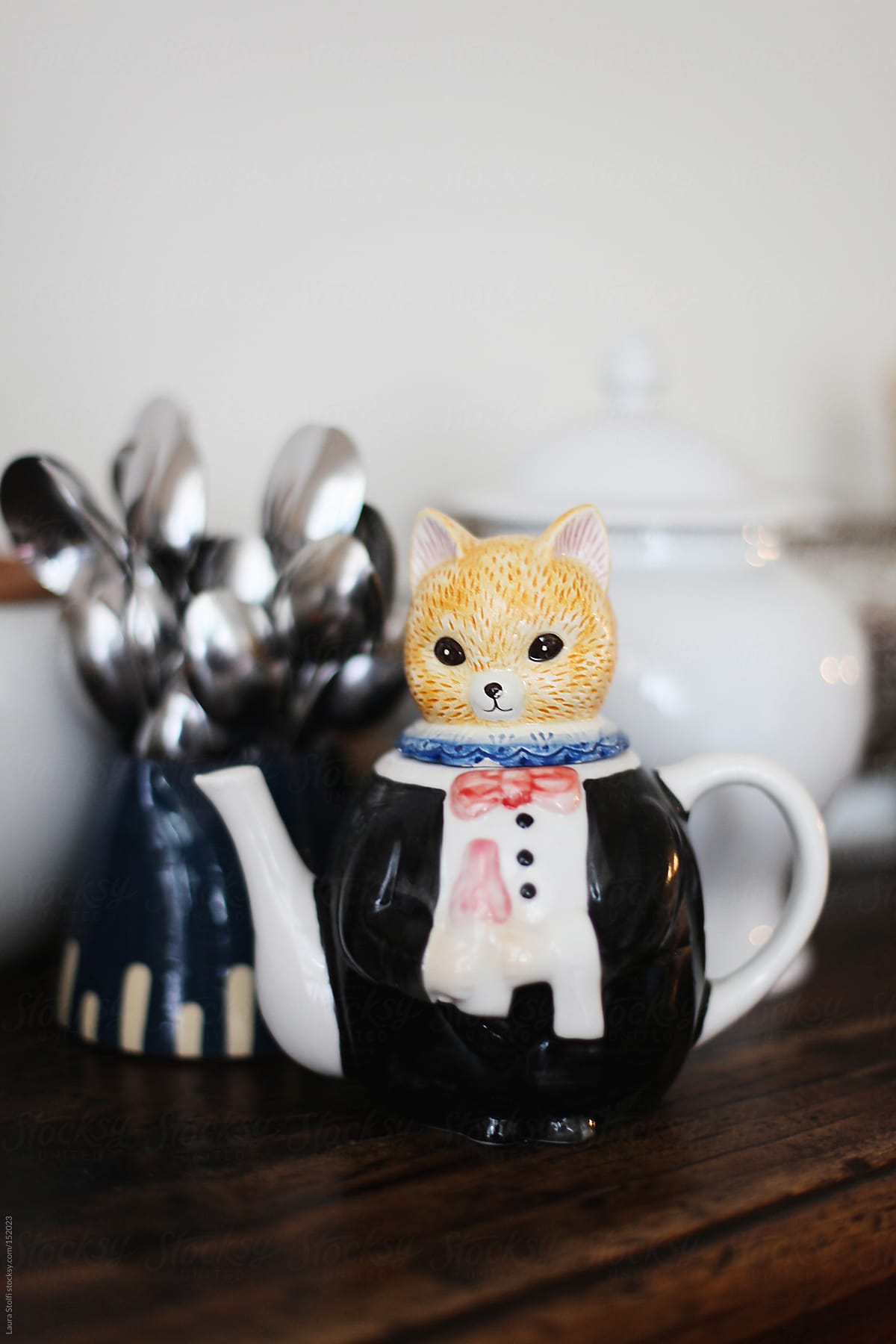Teapot shaped in a frac dress wearing cat