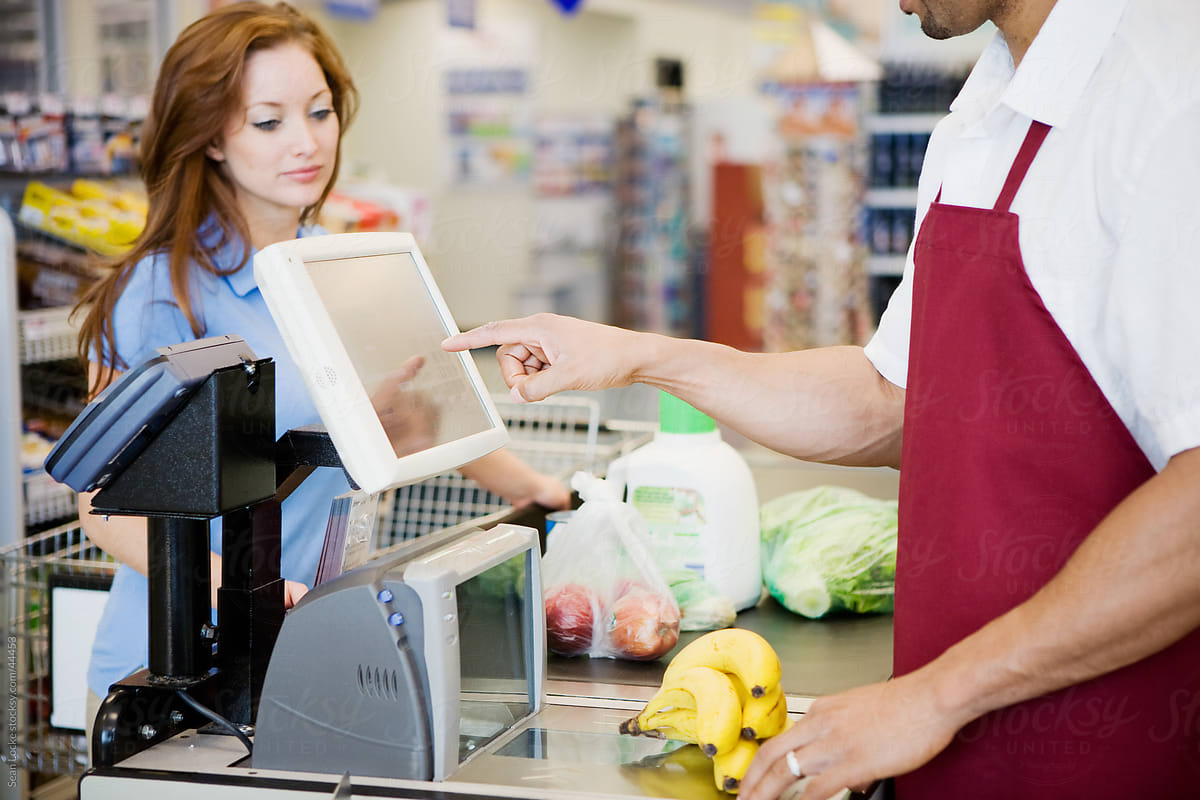 Supermarket: Cashier Ringing Up Purchase
