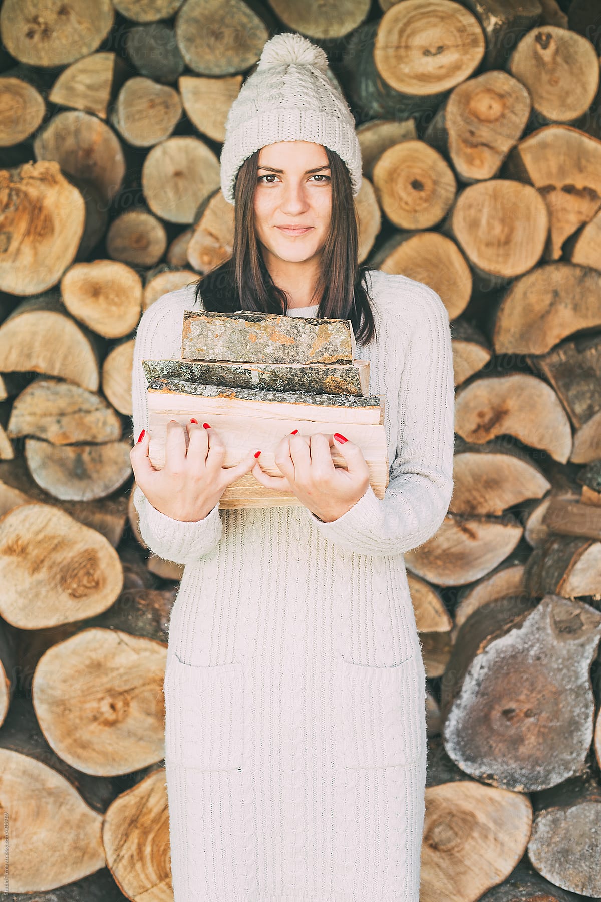 Woman holding chopped wood