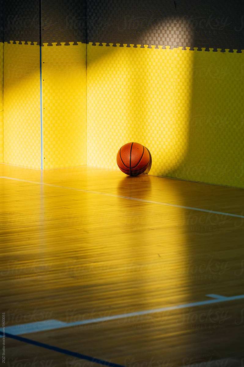 Basketball on basketball court in daytime