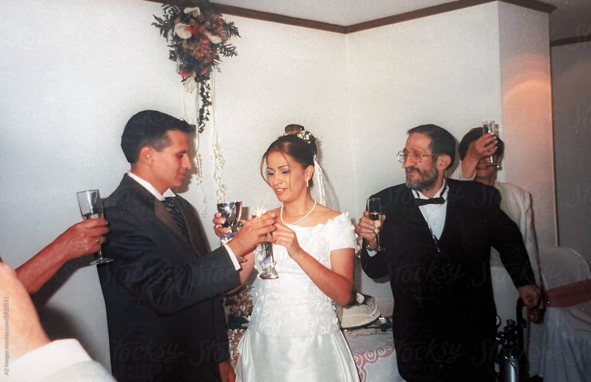 Bride and groom toasting at their wedding