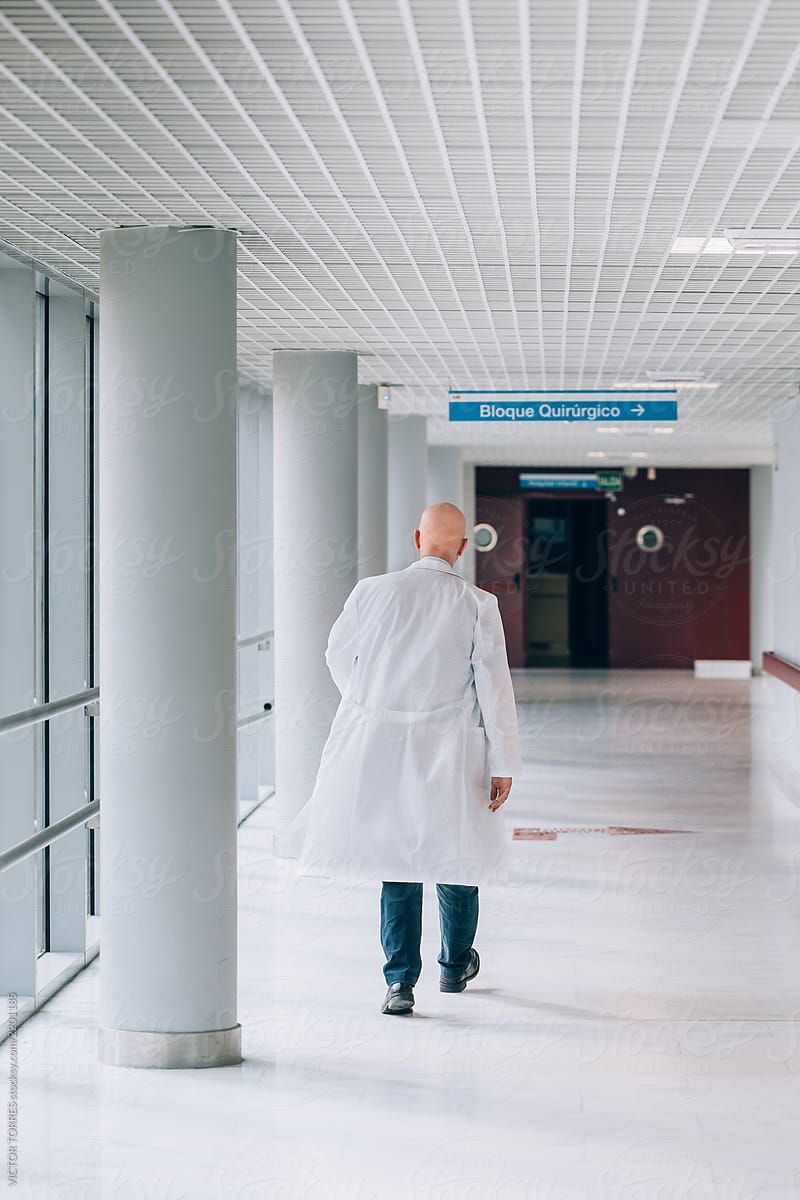 Doctor walking through the hospital corridor