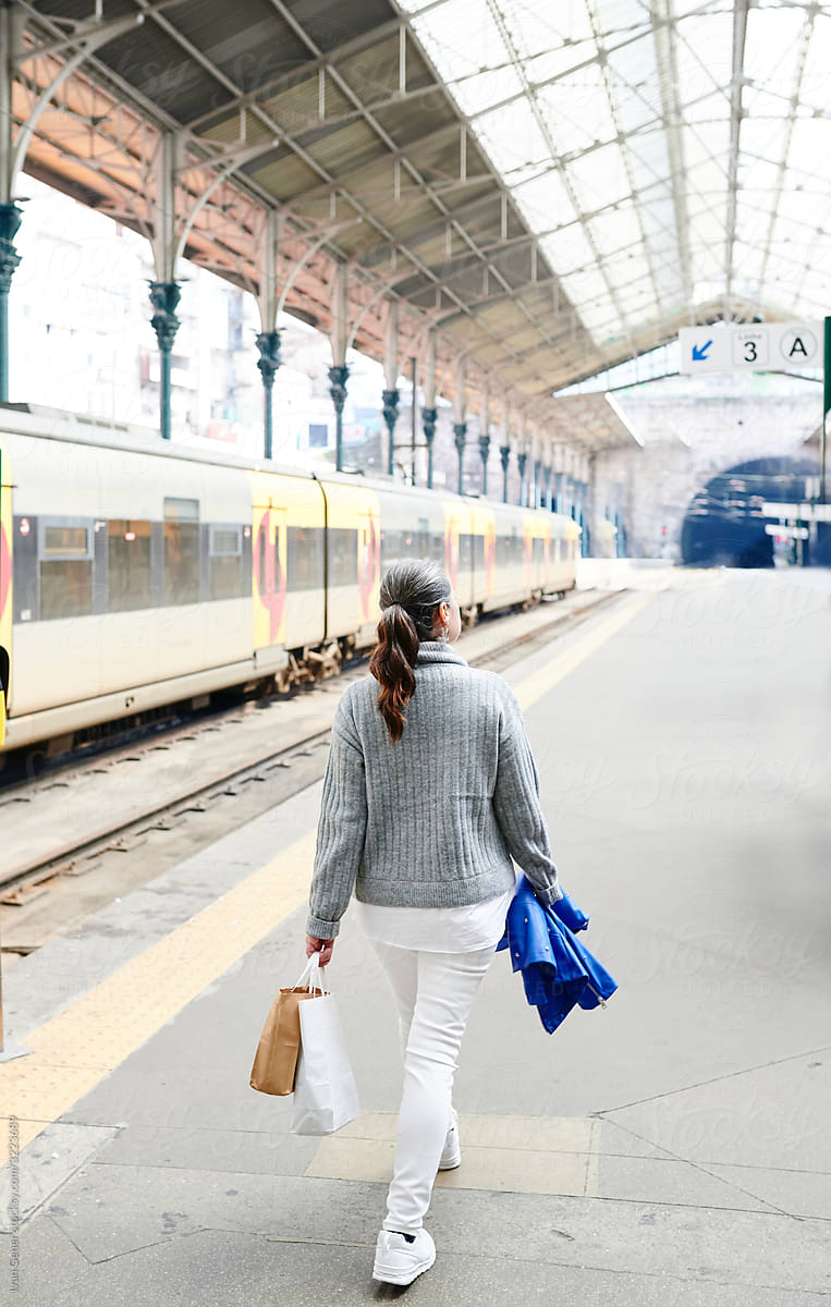 Mature woman walking on a train platform