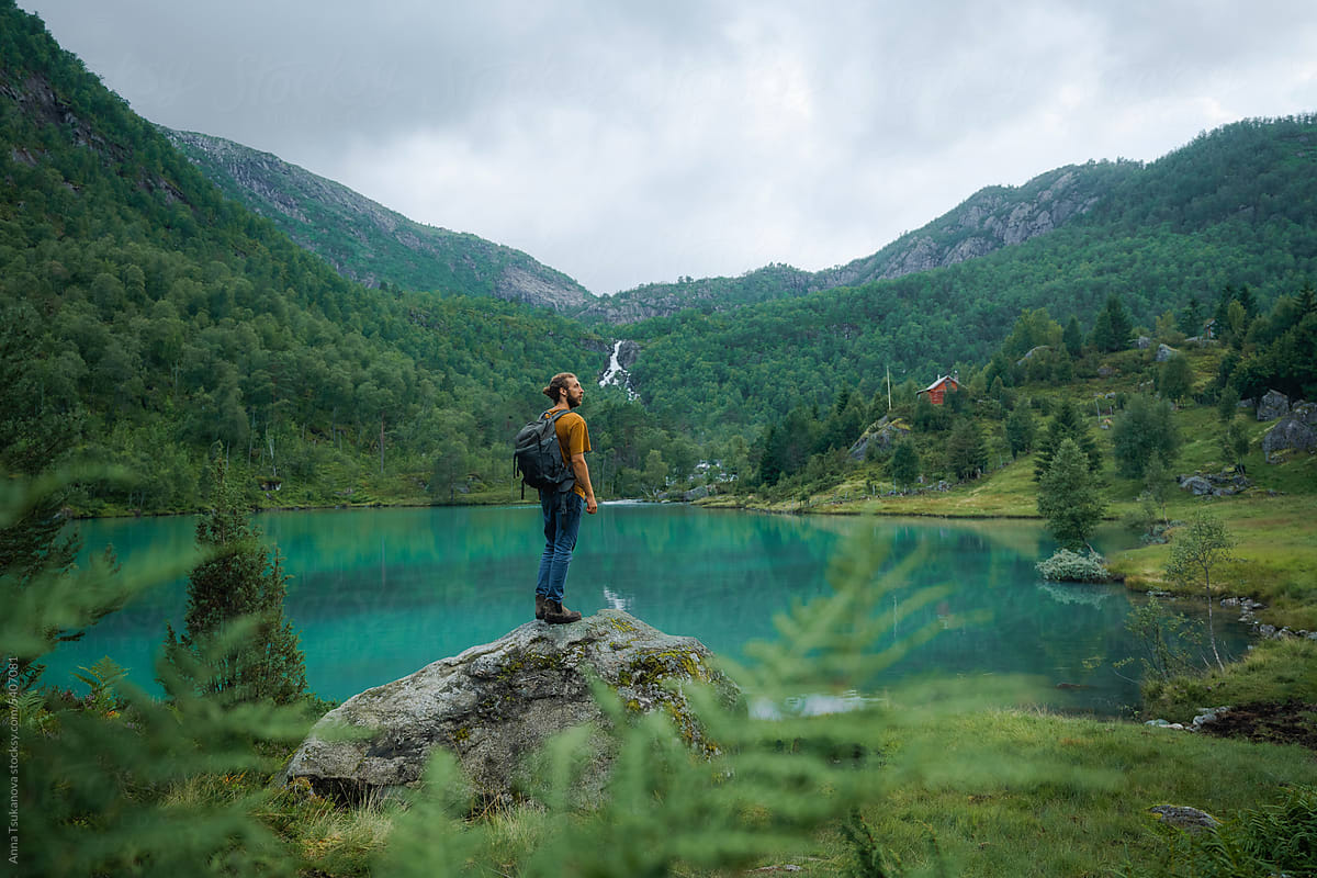 Man looking at lake in Norway during hike